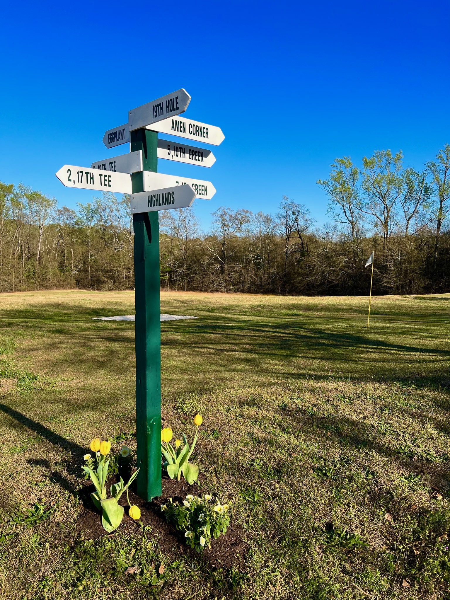 Course directional sign at The Compound Country Club